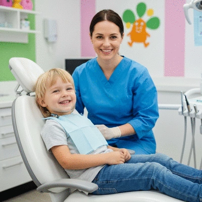 Happy child at a dental check-up with a friendly dentist