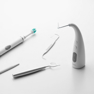 Close-up of modern dental hygiene tools on a clean white surface, no text, no words, no typography, 8K, clean image
